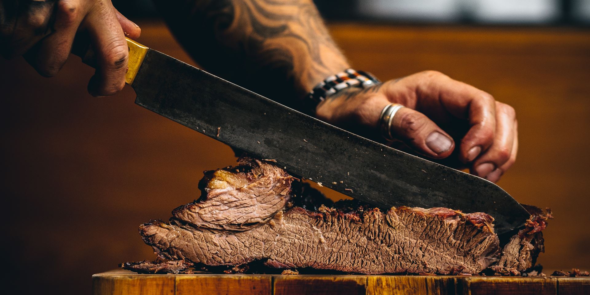 Man slicing steak