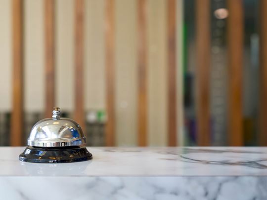 A Single Bell on a Service Check in Desk in a Hotel